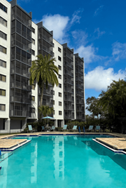 Clearwater apartment for rent - A tall building with a pool at Hampton Apartments, Clearwater, FL, 33759