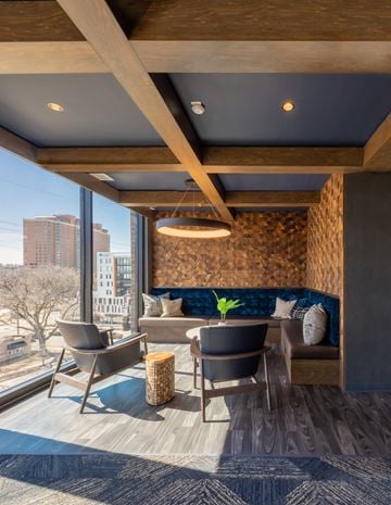 Rochester apartment for rent - a living room with a table and chairs and a large window