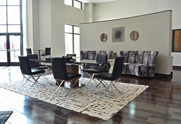 St. Peters apartment for rent - a living room with a table and chairs and a rug