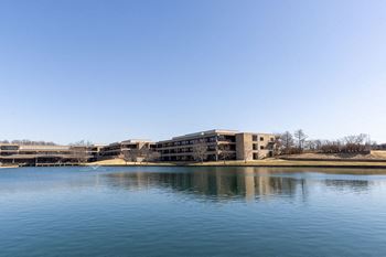 The building where the hotel is located is next to a lake