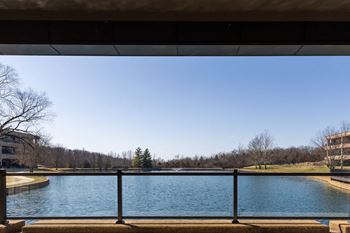 A large pool of water in front of a building