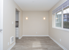 Bremerton apartment for rent - a bedroom with hardwood flooring and a large window