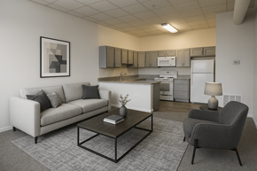 Baltimore apartment for rent - A living room with a couch, chair, and coffee table.