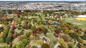 Baltimore apartment for rent - An aerial view of a park with a pond and a walking path.