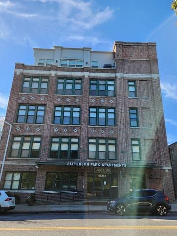 Baltimore apartment for rent - A building with the sign Patterson Park Apartments is shown.