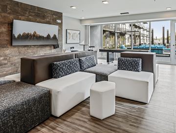 Minneapolis apartment for rent - A modern living room with a grey and white sofa set.