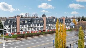 Anchorage apartment for rent - A street view of a building with a red and white facade.
