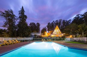 Salinas apartment for rent - pool view with the main cabin in the background at Salinas Sunset Apartments, Salinas, CA, 93907