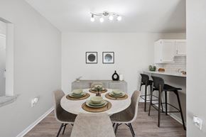 Odenton apartment for rent - A dining room with a table set for two and chairs around it.