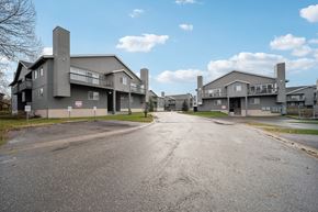 Anchorage apartment for rent - A road leads to a large building complex.