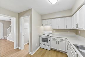 Charlotte apartment for rent - A kitchen with white cabinets and appliances.