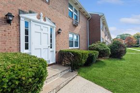 Manchester apartment for rent - the front of a brick apartment with a white door