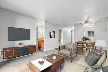 Gresham apartment for rent - A living room with a flat screen TV and a wooden cabinet.