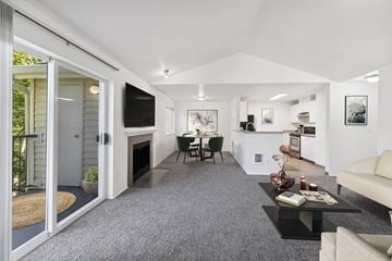 Beaverton apartment for rent - A modern living room with a grey carpet and white walls.