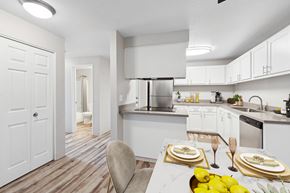 Wilsonville apartment for rent - A modern kitchen with a dining table set for two.