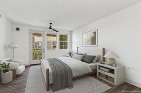 Goleta apartment for rent - A bedroom with a large bed and a ceiling fan.