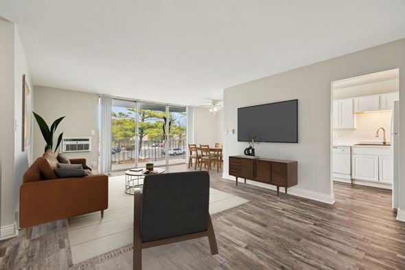Naperville apartment for rent - A living room with a brown couch and a grey chair.