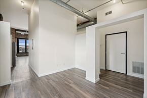 Minneapolis apartment for rent - the living room with wood floors and white walls at Gaar Scott Historic Lofts, Minnesota, 55401