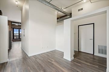 Minneapolis apartment for rent - the living room with wood floors and white walls