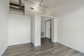 Minneapolis apartment for rent - a bedroom with hardwood floors and white wallsat Gaar Scott Historic Lofts, Minnesota, 55401