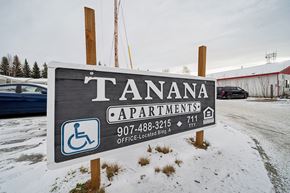 North Pole apartment for rent - Tanana Apartments sign with a phone number and a wheelchair symbol.