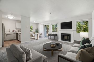 Milwaukie apartment for rent - A modern living room with a grey couch and a coffee table.