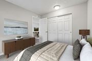 Gresham apartment for rent - A bedroom with a bed, a dresser, and a painting on the wall.