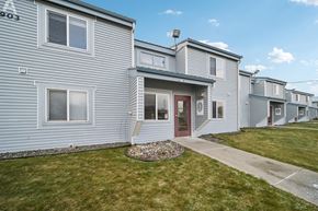 Kenai apartment for rent - A row of houses with a red door in the middle.