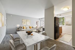 Dumfries apartment for rent - A modern dining room with a marble table and chairs.