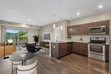 Pittsburgh apartment for rent - A modern kitchen with a dining table and chairs.