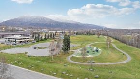 Eagle River apartment for rent - A park with a playground and a mountain in the background.