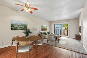 Gresham apartment for rent - A dining room with a table and chairs and a painting on the wall.