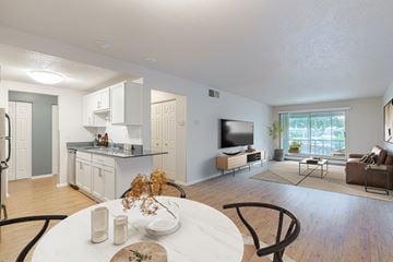 Edina apartment for rent - A modern kitchen with a dining table and chairs.