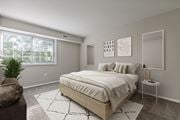 Dumfries apartment for rent - Bedroom with bed and nightstand at Briarwood Apartments, Dumfries, VA, 22026