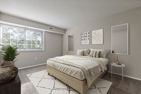 Dumfries apartment for rent - Bedroom with bed and nightstand at Briarwood Apartments, Dumfries, VA, 22026