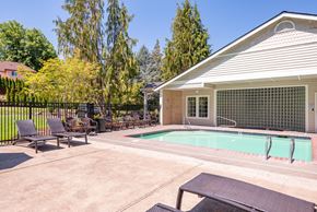 Beaverton apartment for rent - a swimming pool in front of a house with patio furniture at Murrayhill Park, Beaverton Oregon