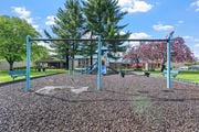 Gresham apartment for rent - A playground with a swing set and a slide.