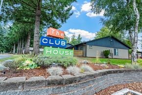 Port Orchard apartment for rent - A sign that says The Club House is in front of a building.