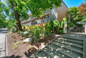 Portland apartment for rent - A building with a green lawn in front of it.