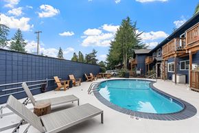Beaverton apartment for rent - A pool with a bench and a wall in the background.