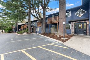 Beaverton apartment for rent - A parking lot with a building in the background.