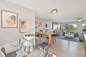 Portland apartment for rent - A modern dining room with a glass table and chairs.