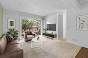Gresham apartment for rent - A living room with a brown couch and a white coffee table.