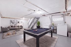 Vernon apartment for rent - A room with a chair, a sofa, a pool table and a washing machine, and dryer..