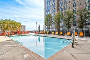 Wheaton apartment for rent - the swimming pool and deck chairs