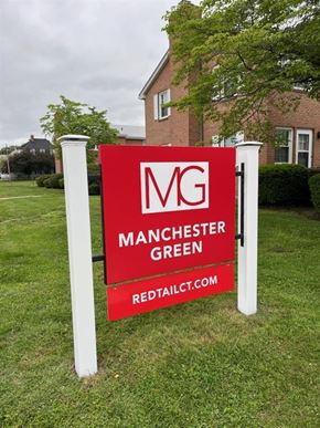 Manchester apartment for rent - A sign for Manchester Green in front of a building.