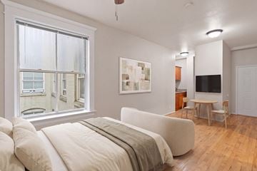 Portland apartment for rent - A living room with a couch and a television.