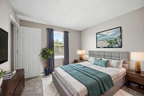 Winchester apartment for rent - A bedroom with a large bed and a painting on the wall.