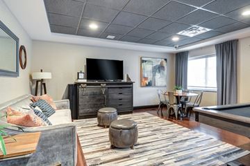 Washington apartment for rent - A living room with a pool table and a television.