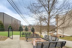 Washington apartment for rent - A park with a fence, benches and trees.